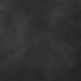 Dark gray matte texture with granular weave, displaying tonal variations and a dense, uniform surface resembling aged leather or fabric.
